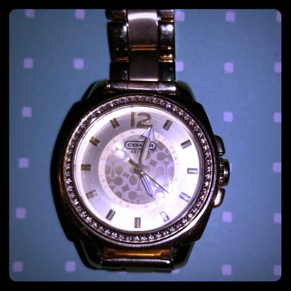 Coach Gold tone watch.